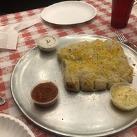 Garlic cheesy bread with vegan ranch, vegan garlic butter sauce and marinara  at Brick Oven Pizzeria in Omaha