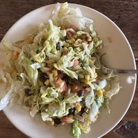 Burrito bowl mixed up a bit to see ingredients.   at El Azteca in Apple Valley