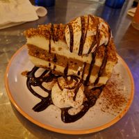 Churro-pumpkin gf vegan cheesecake with chocolate drizzle and coconut whipped cream, a dream 🥹 at Treehouse Taqueria in Ogunquit