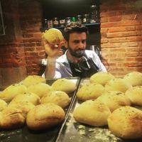 The owner and his home made breads at Le Coucou Rennais in Rennes