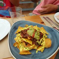 Nachos con Chili y no queso y vegan burguer at Dorothy's Veggie Bistro in La Cueva