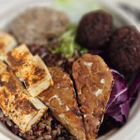 build your own bowl: half grain half veg base, tempeh, tofu, vegan protein balls and eggplant caviar  at TREEHOUSE - H Code in Hong Kong Island