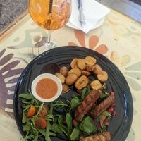 Smoked tempeh with chimichurri, potatoes and seasonal salad at Maslina in Rijeka