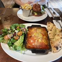 Spiced “lamb” style moussaka & symplicity burger with french fries  at The Akeman Inn in Aylesbury