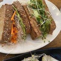 Sandwich with lot of veggies and sprouts  at Peacefood Cafe - Uptown in New York City