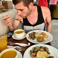 The meal was some kind of mango/orange juice, what I believe to be a butternut squash soup, brown rice, their spin on a falafel, warm eggplant salad and this pie-like thing haha. That's my non-vegan friend enjoying every last bit of it before proclaiming that it was one of his best meals in Cartagena. at Girasoles Restaurante Vegetariano in Cartagena