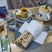 One half of the vegan shawarma 😵 + the dips and pickles at Bayt Sara in Amman