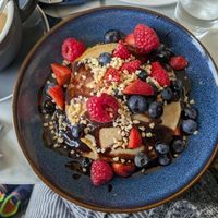Pancakes with fruit, nuts and maple syrup at Skinny Batch Bakery in Lusk