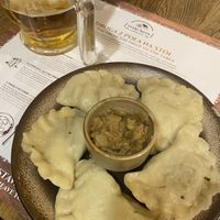 Pierogi filled with sauerkraut and mushrooms. Came with a caramelised onion dressing    at Pierogarnia Stary Młyn in Gdansk