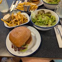 Like Chicken Burger with fries and salad at Cafe Populaire in Fribourg