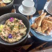 Hummus with bread at Socials  in Tashkent