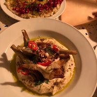 Minced smoked eggplant and grilled artichoke hummus are amazing!  at Farès in Lisbon