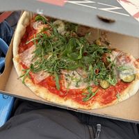 Half eaten pizza, because we were hungry  at Da Francesco in Nice