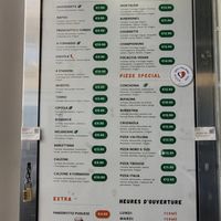Current menu and prizes of all pizza's in French. There's also a menu on English hanging on the right at the counter. (July 14, 2024) at Da Francesco in Nice