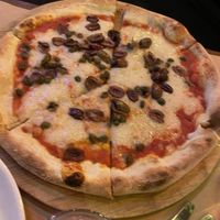 Vegan version of flying anchovy. Olives, capers and vegan cheese  at Tony Tomatoes in North Adelaide