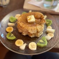 2 pancakes with maple syrup, vegan butter and fresh fruit  at Vegateau - Vegan Coffeebar and Bakery in Antwerpen