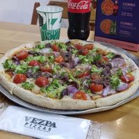 They have an awesome combo deal which includes a medium pizza and drink for 39.90 reals at Vezpa - Copacabana in Rio De Janeiro