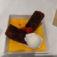 Vegan sticky date pudding with vanilla ice cream at Caruso's in Gymea
