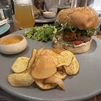 Burger with chips (crisps)  at Greenr Cafe in New Delhi