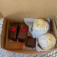 Vanilla Cupcakes, a brownie, and Black Forest pastries.  at Rheinlander Bakery in Arvada