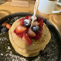 Breakfast pancakes with syrup and berry compote   at Legoland in Windsor