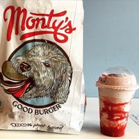 Bag of burgers and strawberry shake   at Monty's Good Burger - Echo Park in Los Angeles