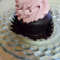 Chocolate cupcake with raspberry frosting. at Cara Mia in Lomita