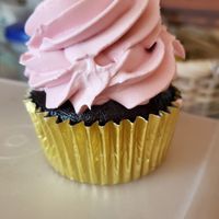 Chocolate cupcake with raspberry frosting. at Cara Mia in Lomita