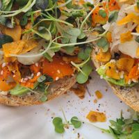 Bagel with coconut bacon, carrot lox and cashew cream cheese  at The Sprout Kitchen in St Augustine