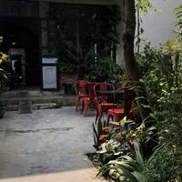 Outdoor seating. Two floors of indoor seating and out outdoor table on upper back balcony  at Brick Coffee in Ninh Binh