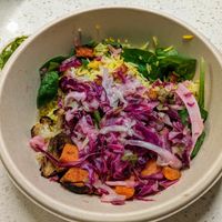 Saffron rice and greens. at CAVA - Domain Dr in Austin