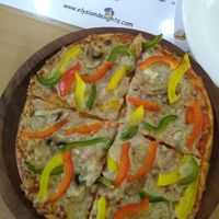 All veggie pizza at Elysian Delights - Ethigreenz in Gurugram