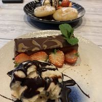Chocolate biscuit cheesecake and pineapple fritters at Puti Vegan Cafe in Glasgow