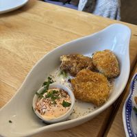 Crispy buffalo cauliflower bites harissa mayo  at Goji Vegetarian Cafe and Deli in York