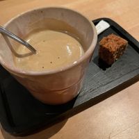 Coffee with non-dairy milk and a vegan pastry  at De Zeezot in Westkapelle