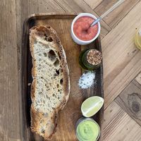Avocado toast with tomato pure, lime, extra virgin olive oil and salt with chives.  at Pacífico in Ourense