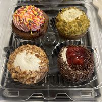 Maple raspberry, pistachio, carrot cake, and black forest cupcakes at Edge of the Woods Natural Market in New Haven