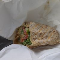 Edge Burger with tahini sprouts and veggies no cheese on a whole wheat wrap at Edge of the Woods Natural Market in New Haven