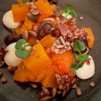 Pickle pumpkin, tender pumpkin, cream cheese, caramelised pumpkin seeds and walnuts. at Ragu in Helsinki