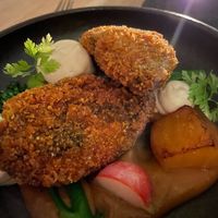 Steamed vegetables, yellow beetroot, radish, eggplant cream and breaded portobello mushrooms. at Ragu in Helsinki