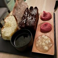 Focaccia, beetroot hummus, sweet bread, apple jam. at Ragu in Helsinki