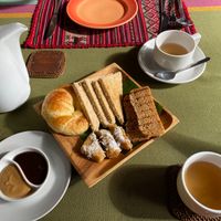 Breakfast bread platter and coffee at BeingSattvaa in Ubud