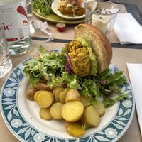 Burger, lasagna, and the seran wrap found on top of the lasagna dish  at apeti - Ségur in Paris
