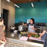 Cooking demonstration using foods from local vendors at Siloam Springs Farmers Market in Siloam Springs