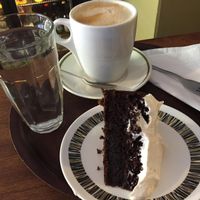 Chocolate and Stout cake and oat milk latte  at Fortify Cafe in Maidstone