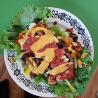Taco salad dressed with market vegetables and a vegan queso purchased from @fromthegroundupfoods. at Exhibition Park Farmers' Market in Lethbridge
