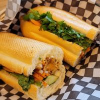 Bánh Mì Chay

Sandwich Chay ￼

Toasted 10” baguette, loaded with crispy tofu strips coated in sweet and garlicky sauce, crunchy cucumber, pickled carrot & daikon, jalapeno,  at Pho Kitchen in Vancouver