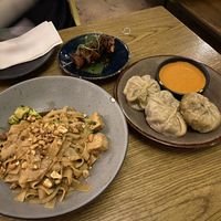 Pad see ew, mushroom skewers, and momos   at Plantasia in Mexico City