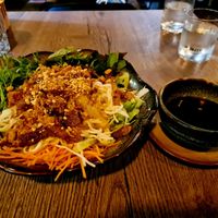 Rice noodles with veggies and tofu and several toppings at Soy in Munich