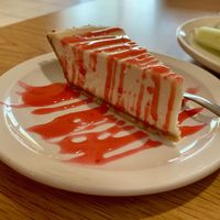 Cheesecake with strawberry drizzle   at Loving Cafe in Fort Wayne